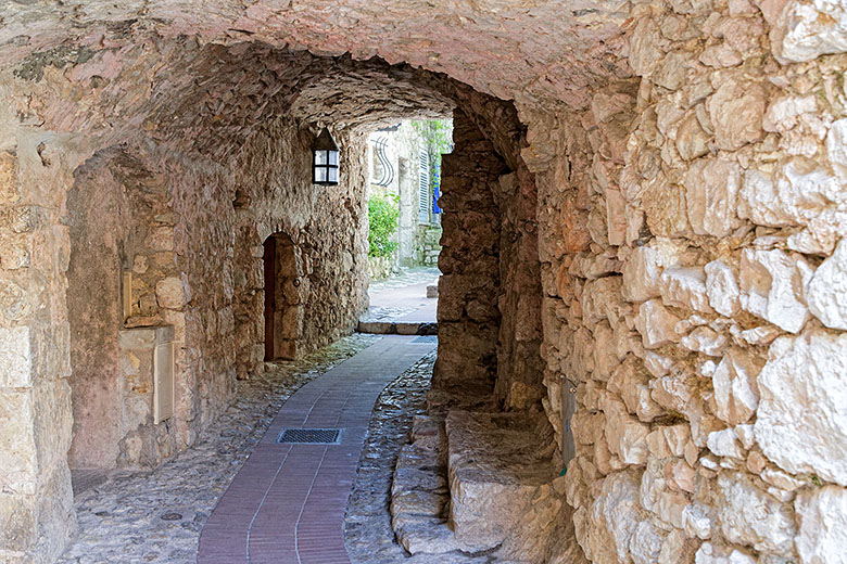 In several areas, the street runs under the houses