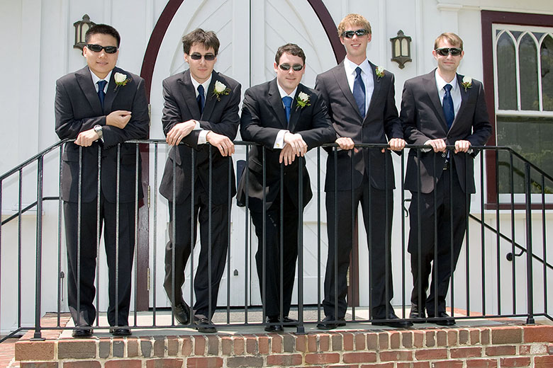The groom with the best man and the groomsmen