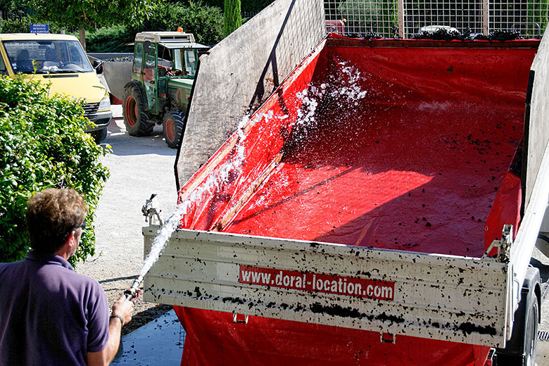 The trucks or wagons are hosed down...