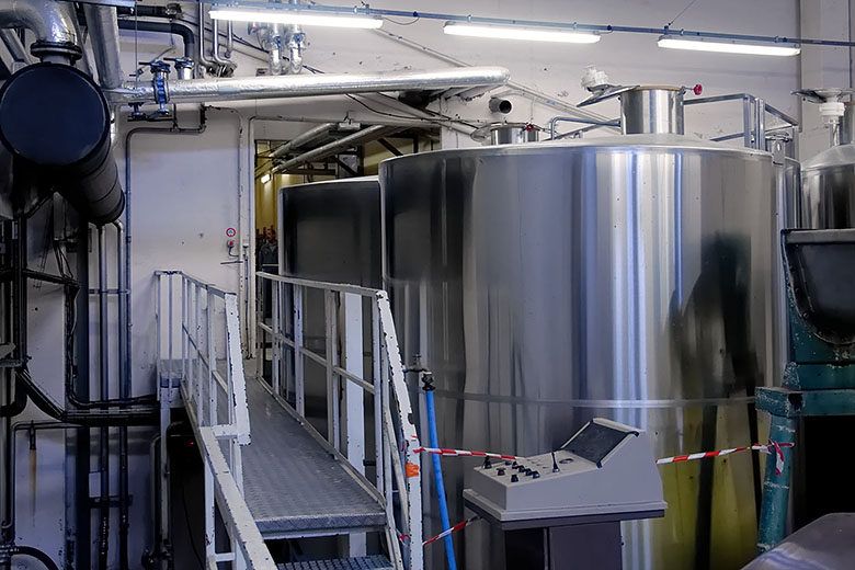 Everywhere one looks, there are pipes, tanks, control panels...