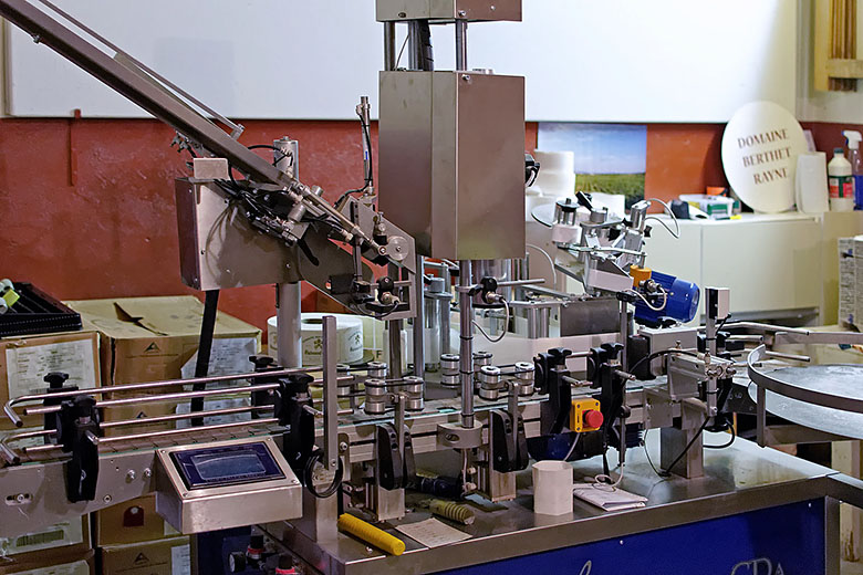 Corking, capping and labeling machine