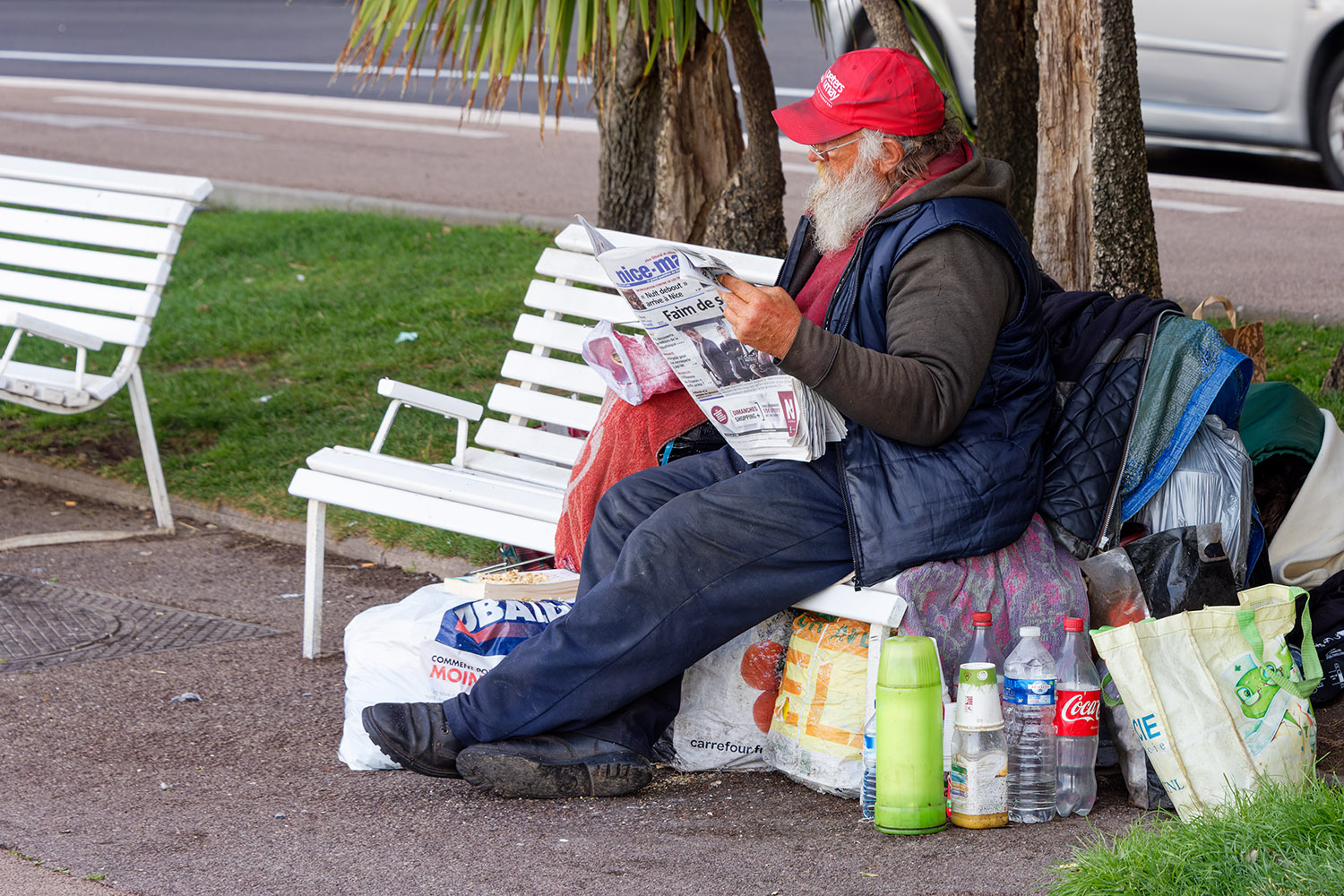 Homeless Man Keeping Up With the News