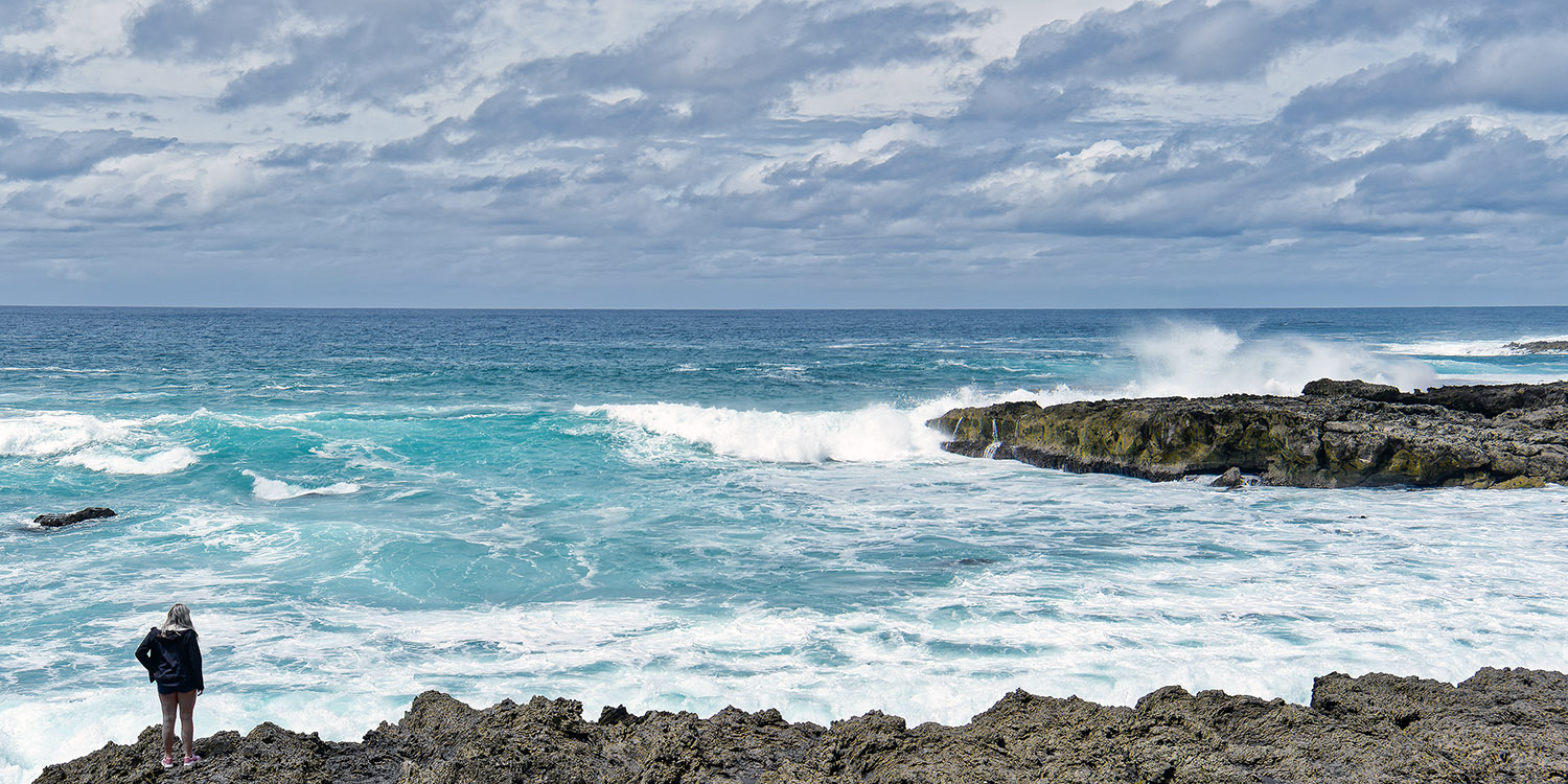 Woman admiring the Pacific Ocean