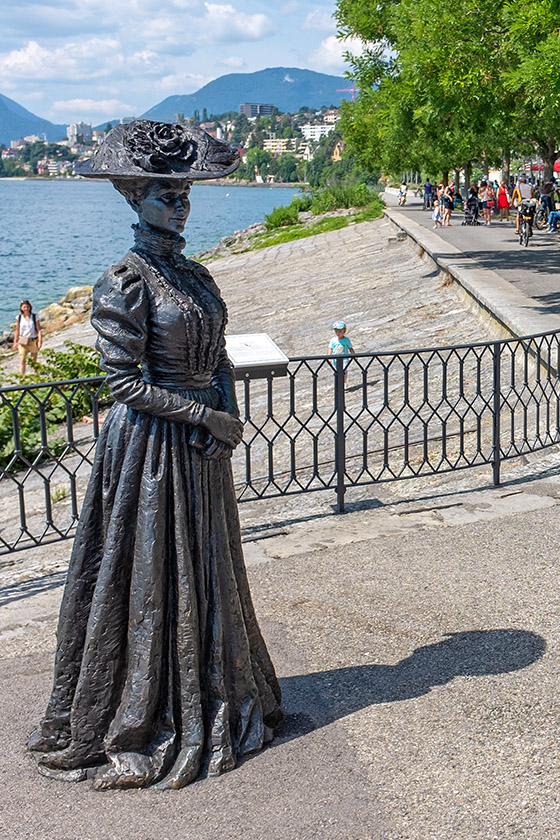 Statue of a woman in early 20th Century attire...