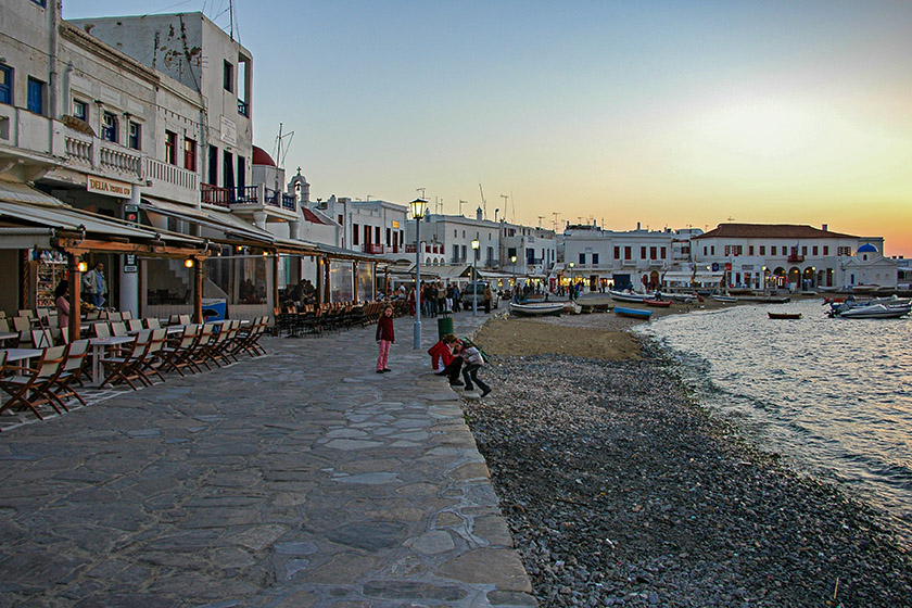 Along the Mykonos harbor at dusk