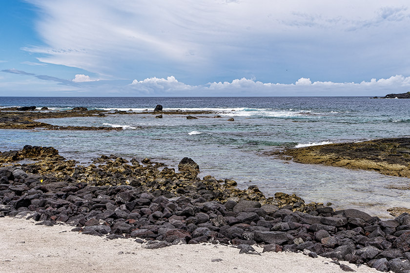 Black volcanic rocks by the sea shore