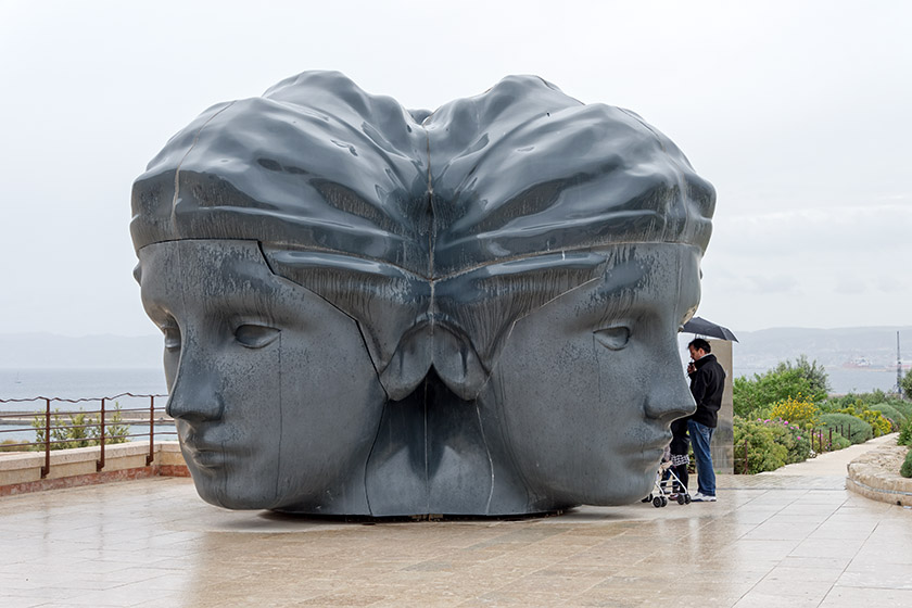 This giant sculpture of three heads opens up into a puppet theater!