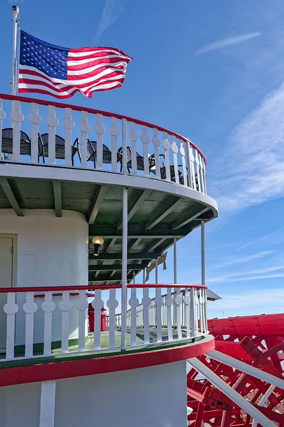 Riverboat with paddle wheel