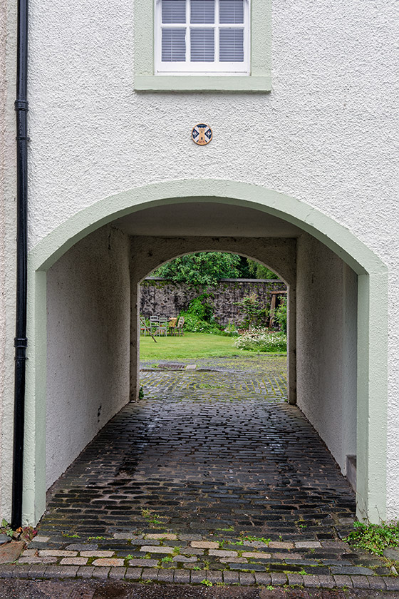 Archway to a quiet backyard